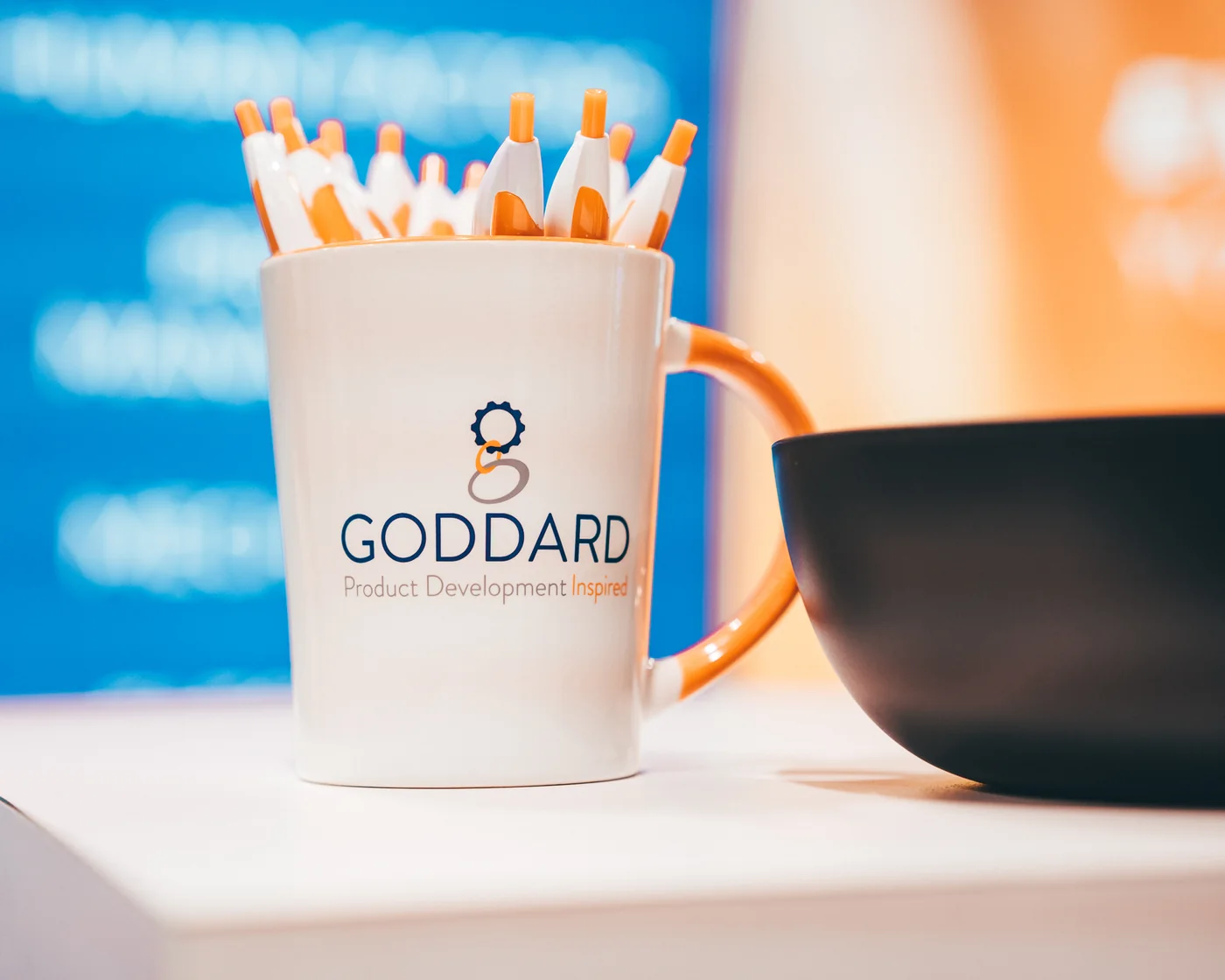 Goddard branded mug and pencils at the expo booth