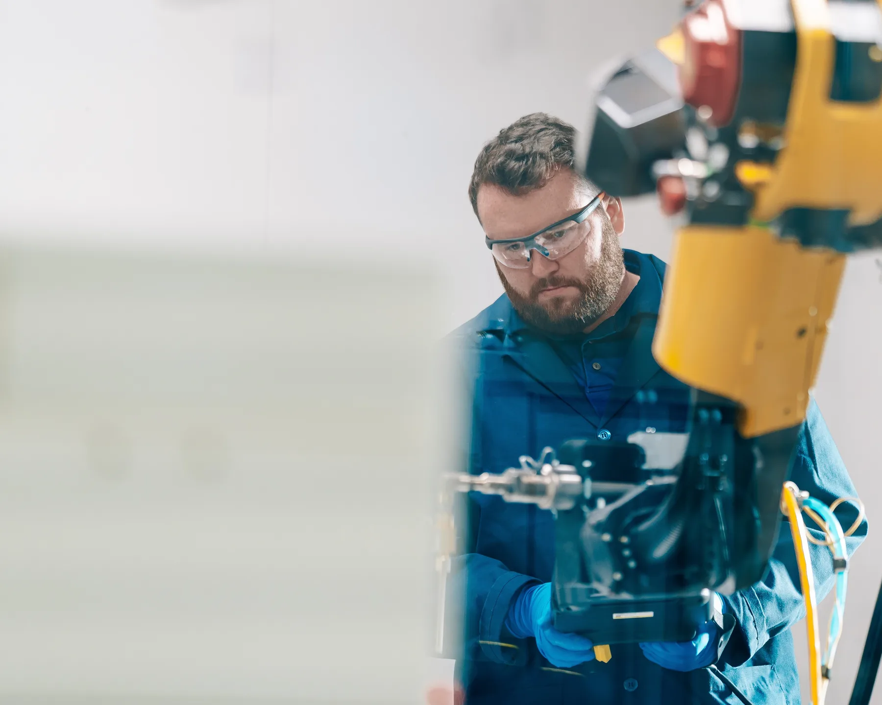 A researcher working carefully with technical equipment at the Roux Institute