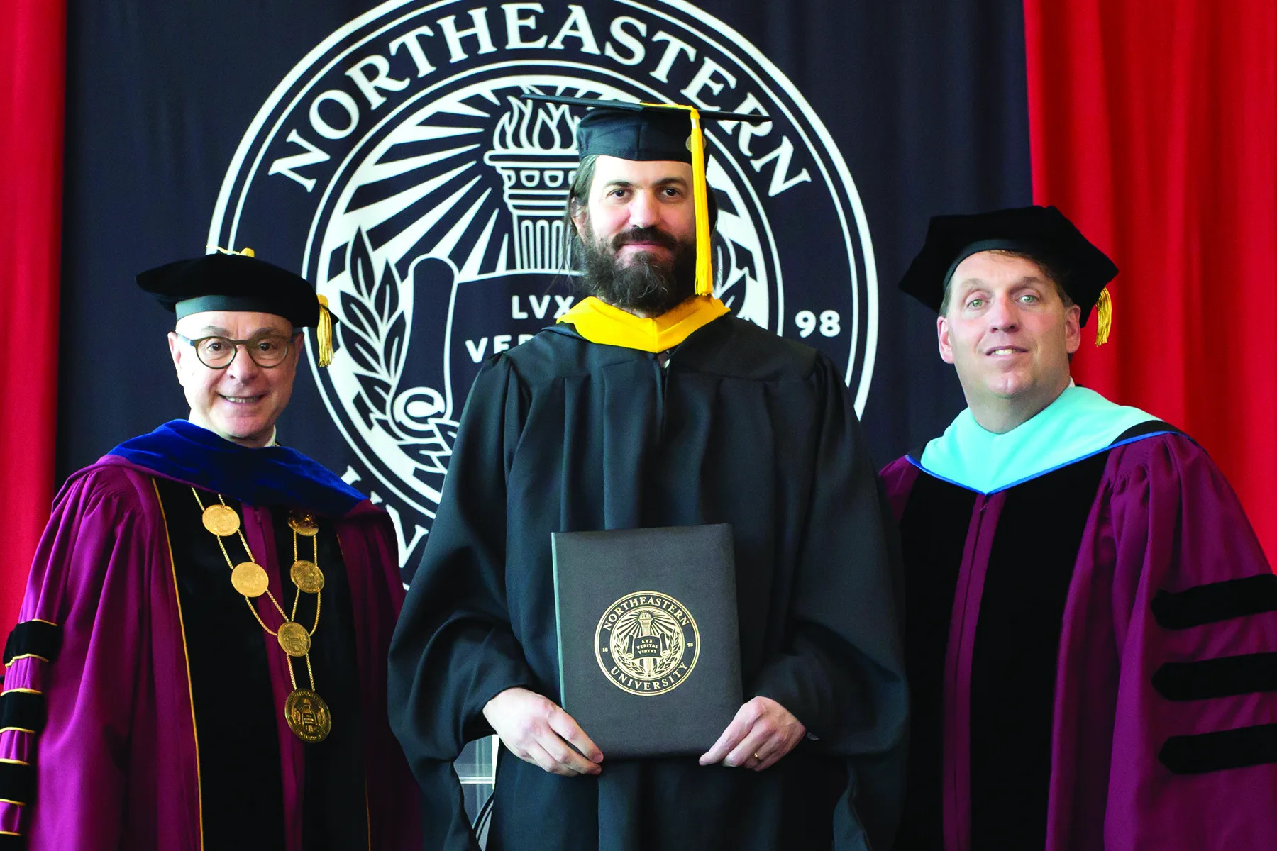A Roux graduate with university leadership at commencement